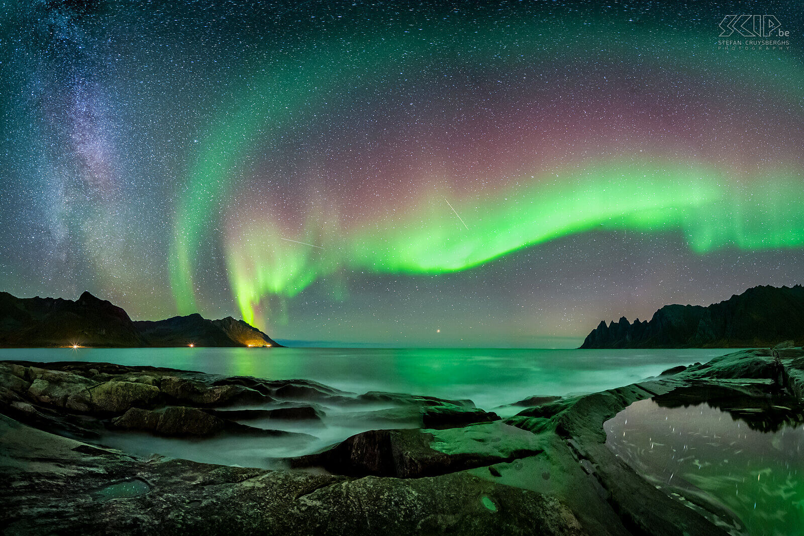 Senja - Tungeneset - Northern lights A panorama image of a magical night at the rocky beach of Tungeneset on Senja island in Norway. The northern lights (aurora borealis) were very active with wonderful green and red colors, the milky way was also visible and my camera captured some shooting stars. The bright star at the horizon in the middle of the image is Arcturus. Stefan Cruysberghs